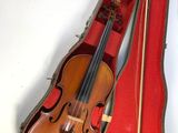 a violin in a case with a bow in it