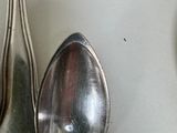spoons and spoon spoons hanging on a wall