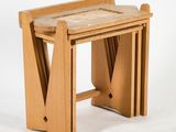 a small wooden table with a marble top on a white background