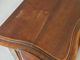 a close up of a wooden desk with a white background