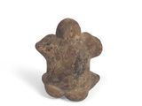 an image of a small stone object on a white surface