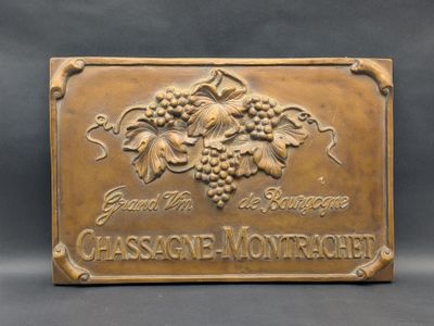 a close up of a plaque with a bunch of grapes on it