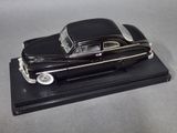 a black model of a car on a black base