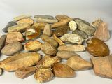 a pile of rocks and stones on a white surface