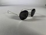 a close up of a pair of sunglasses on a white surface