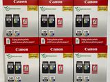 four boxes of canon ink cartridges sitting on top of each other