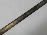 a close up of a metal object with writing on it