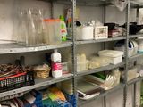 many shelves of food in the kitchen with pots and pans on them