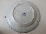 a white plate with a blue and white design on it