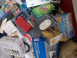 a pile of assorted items sitting on a bed