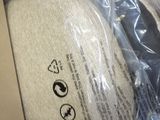 a white hat that is in a box on a table