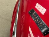 a sticker on the hood of a red car