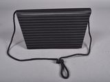 an image of a black purse on a white surface