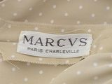 marc ' s label on a dress with white polka dots