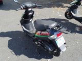 a scooter that is parked in the parking lot