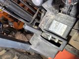 a close up of a forklift with a small device on top of it