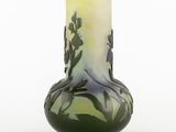 a vase that has a green and white design on it