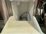 a white dishwasher sitting in the middle of a kitchen