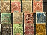 an image of a collection of old postage stamps on a table