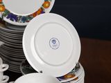 a lot of plates and cups on the table