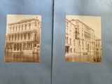 an old photo of a couple of pictures of buildings on a street
