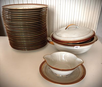a stack of plates and bowls on a table