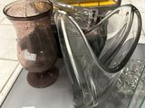 two vases that are sitting on a table