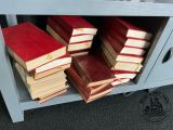 a lot of books stacked on top of each other