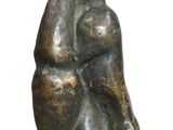 an image of a bronze statue of a woman sitting on her knees