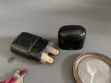 a picture of a pair of scissors, a mirror, and a lighter on a table