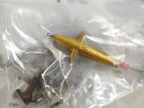 a small toy airplane in a plastic bag on a table