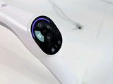 a white electronic device sitting on top of a table