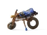a toy motorcycle with a basket on the back of it