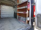 a white van that is parked in a lot