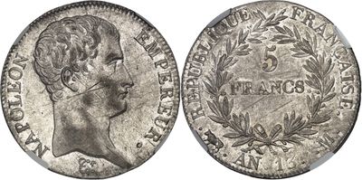 a silver coin with a woman ' s head and laurels on it