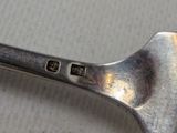 a close up of a spoon on a table
