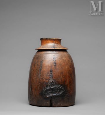 an image of a wooden vase with a tree on it