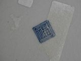 a white plate with a blue and white design on it