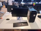 a desktop computer sitting on a desk with a keyboard and mouse