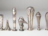 a lot of silver objects that are on a table