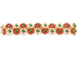 a close up of a bracelet with red and green beads