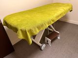 a table with a yellow cloth on it in a room