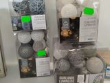 two packages of decorative balls on the counter