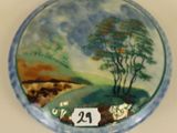 a picture of a plate with a painting on it