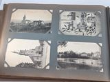 an old photo of a book opened to show pictures of a castle