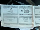 a stack of papers sitting on top of a car seat