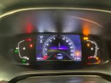 the dashboard of a car with a digital display on it