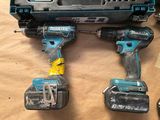two cordless drillets sitting on top of a piece of paper