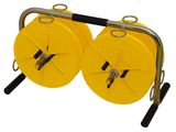 a pair of yellow reels are attached to a metal rod