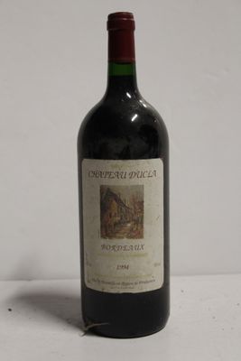 a bottle of wine that is sitting on a table